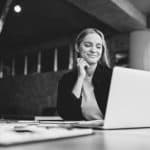 A woman looking at a computer