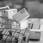 A shopping cart with boxes inside