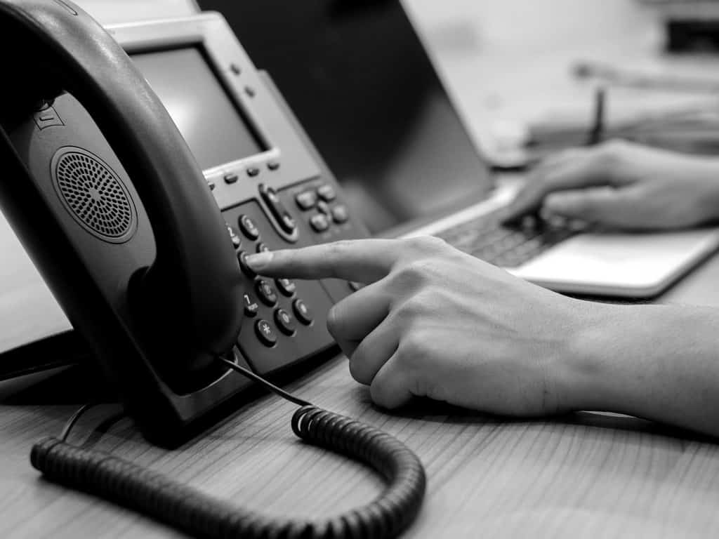 dialing office phone black and white image