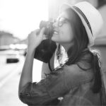A woman taking a photo - Golden Proportions Marketing