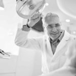 A dentist with a patient - Golden Proportions Marketing