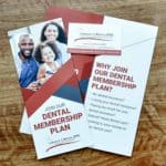 brochure for dental membership plan on table - Golden Proportions Marketing